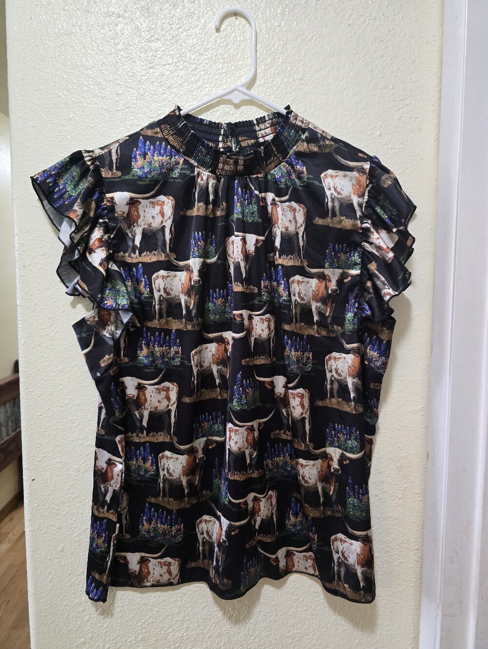 Sterl8ng Kreek Sleeveless Ruffle Cow-Print Blouse in Black